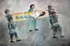 People carrying a girl on a stretcher. Painting by Emiko Toki & Syouichi Fukahori / Courtesy of Nagasaki Prefecture radiation victim's pocketbook club